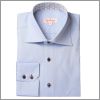 Chemise bleue � boutons marrons et col int�rieur motif bleu et marron