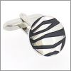Round cufflinks with black patterns