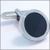 Oval cufflinks with screws and a black core