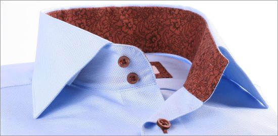 Blue shirt with brown floral collar and cuffs and brown buttons